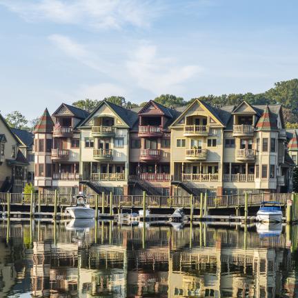 Photo: a series of townhomes and condos on a lake.