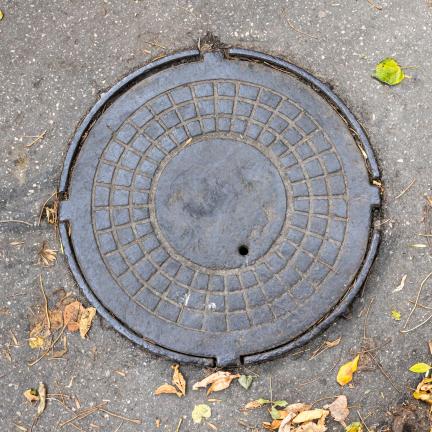 Photo: the top of a manhole lid