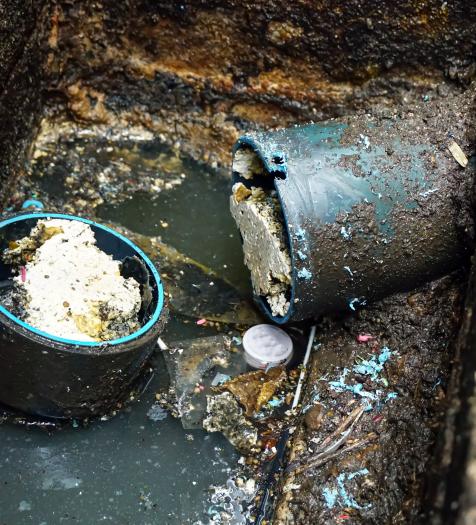 Photo: sewer pipes clogged with grease deposits