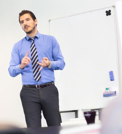 Photo: a man giving a business presentation